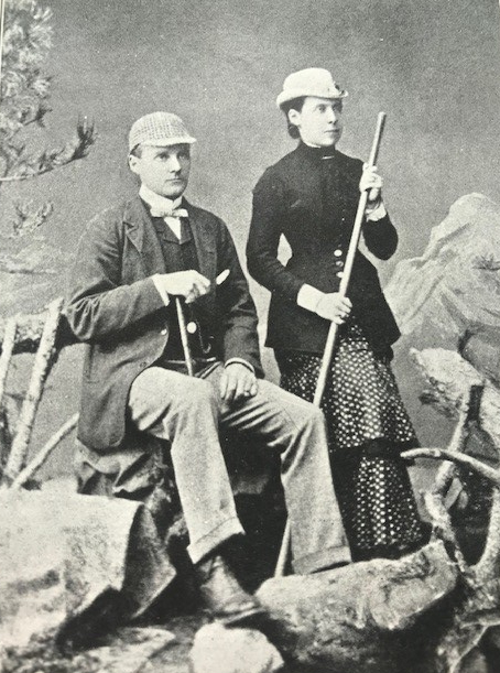 man and woman with sticks